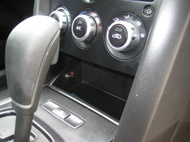 GF100 laser jammer installed to centre console in VE Ute.